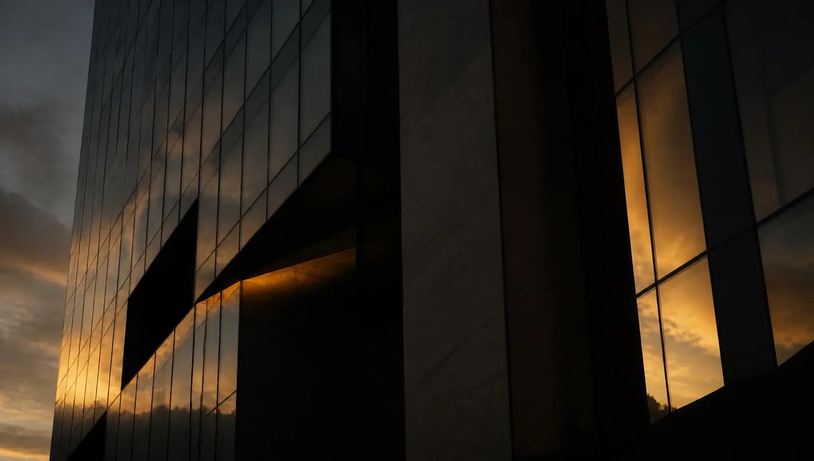 Modern office tower façade at dusk